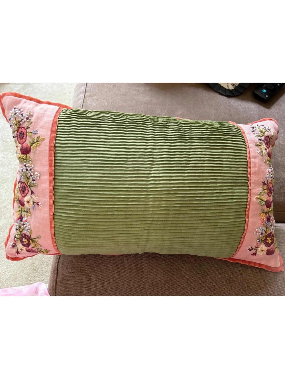 Two beautifully embroidered decorative lumbar pillows.